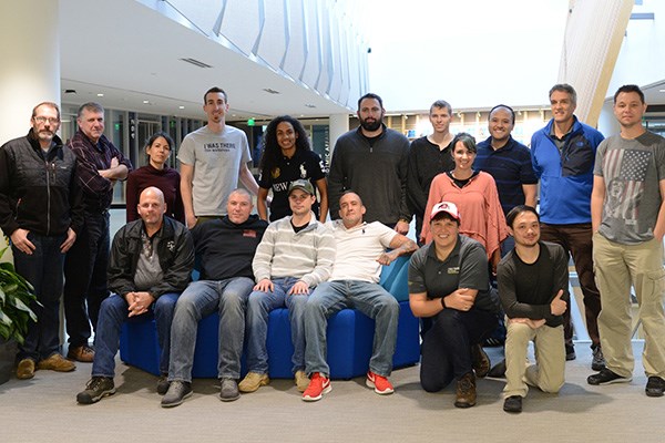 Ben Patton poses with UMass Lowell veterans that came out for the workshop.