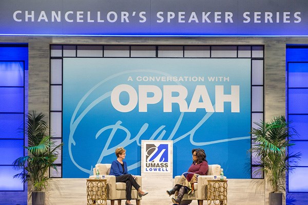 UMass Lowell Chancellor Jacquie Moloney and Oprah Winfrey on stage at the Chancellor's Speaker Series