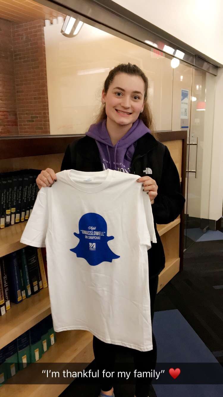 UMass Lowell student holding Snapchat t-shirt is thankful for her family
