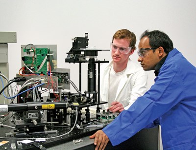physics-2-males-looking-at-equipment