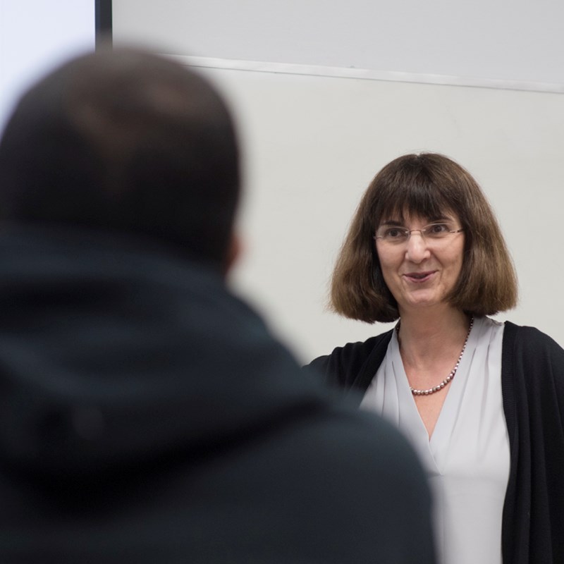 Monica Galizzi, Chair of Economics, speaks to a student