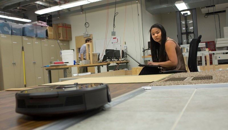 UMass Lowell student Qiana Curcuru works at iRobot designing and building a friction test track for prototypes of the next generation of Braava Jets, the company’s floor-mopping robots