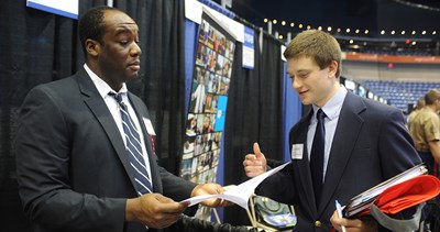 David Chieh III - Verizon corporate recruiter looks over Jonathan Campelli's resume at the Career Fair at the Tsongas Center.