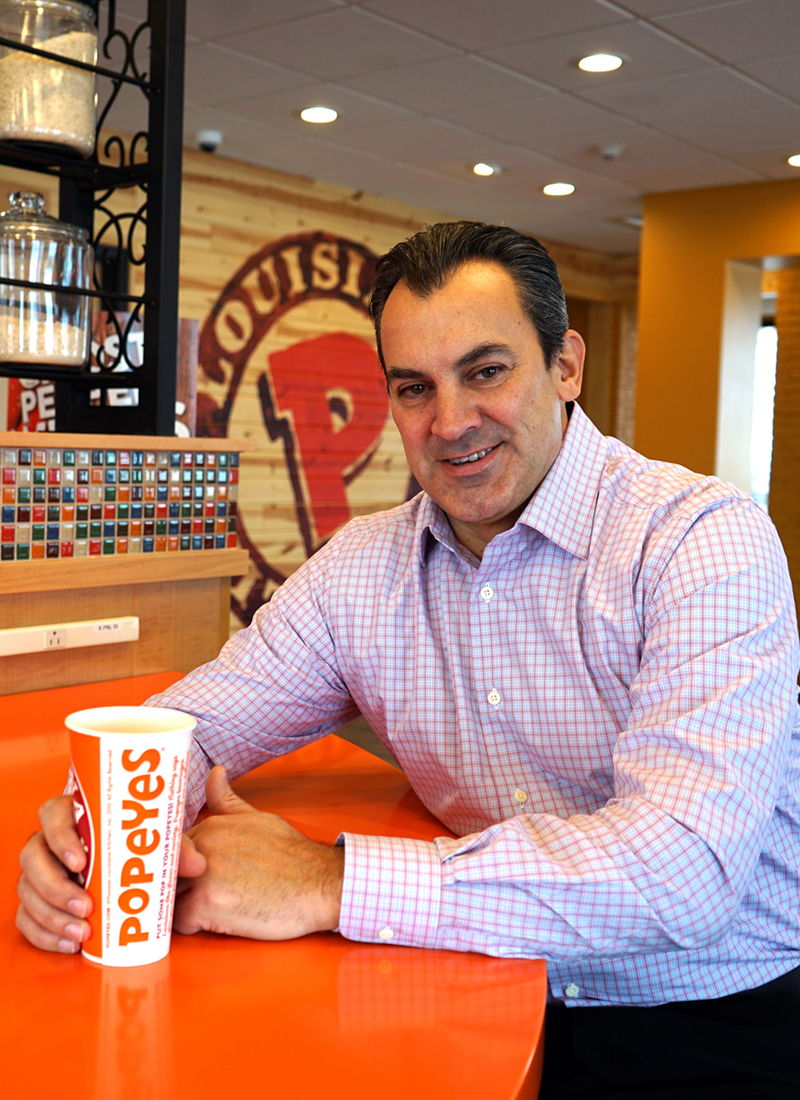 Rob Parsons sits in the Popeyes he owns in Nashua, NH