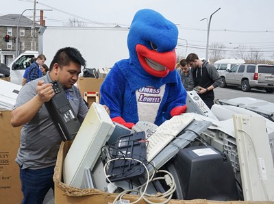Rowdy the River Hawk assists with electronic recycling at UMass Lowell. Free, secure, recycling events for UMass Lowell Community Members are offered in the fall and spring each year by the Office of Sustainability and the IT Information Security Department.