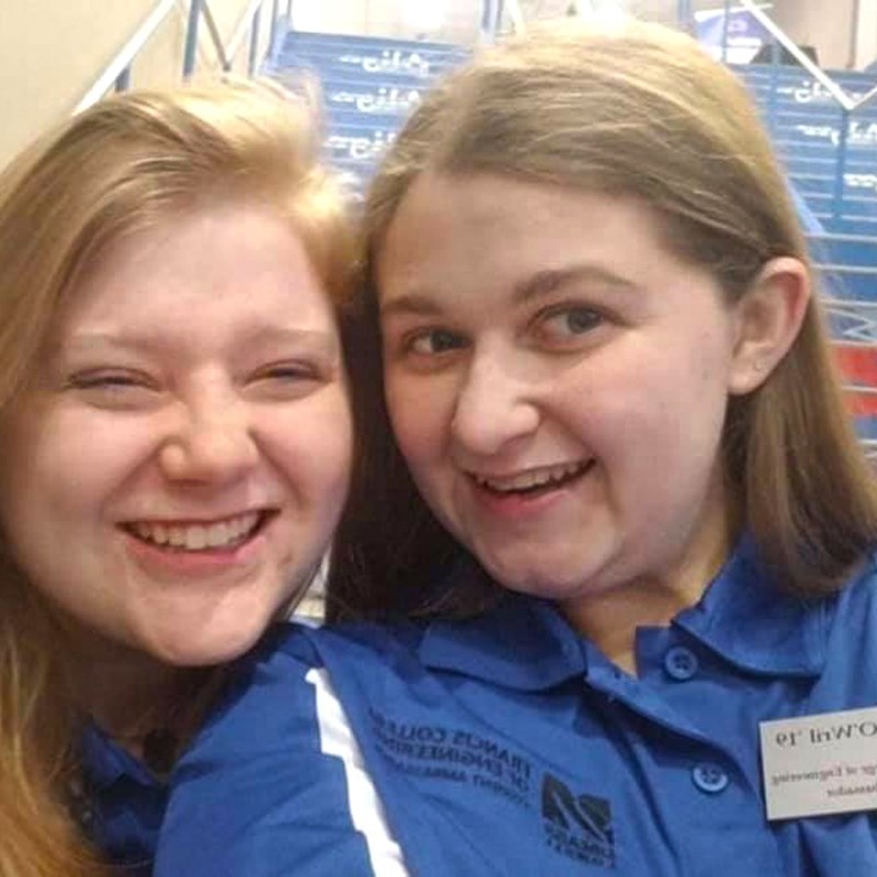 Samantha O’Wril, president of the Francis College of Engineering’s Student Ambassadors program, poses with a fellow ambassador at an event