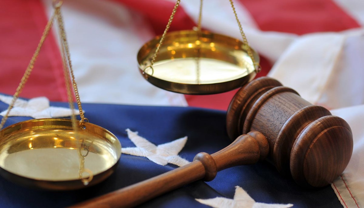 Scales of justice, gavel and American flag