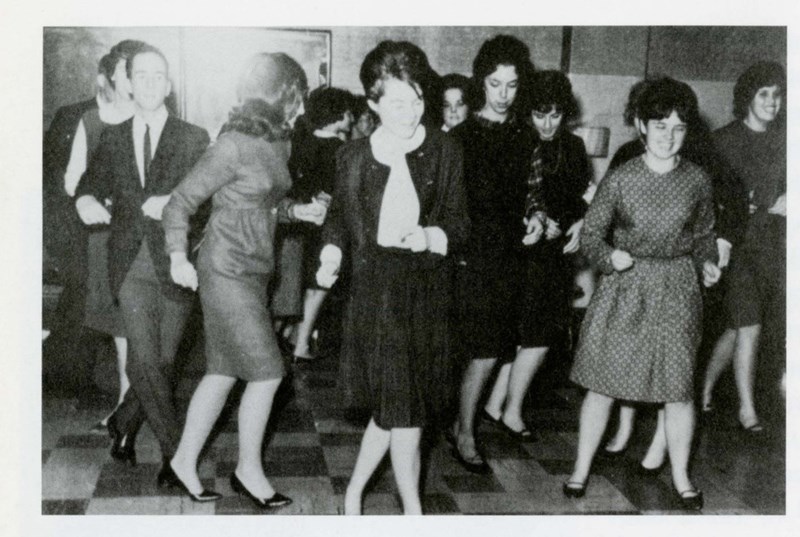 Students at school dance dancing in 1964