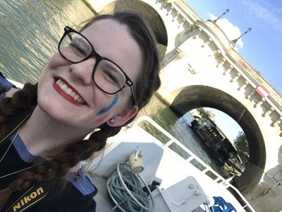 UMass Lowell study abroad student selfie picture while taking a boat tour of the Seine in Paris.