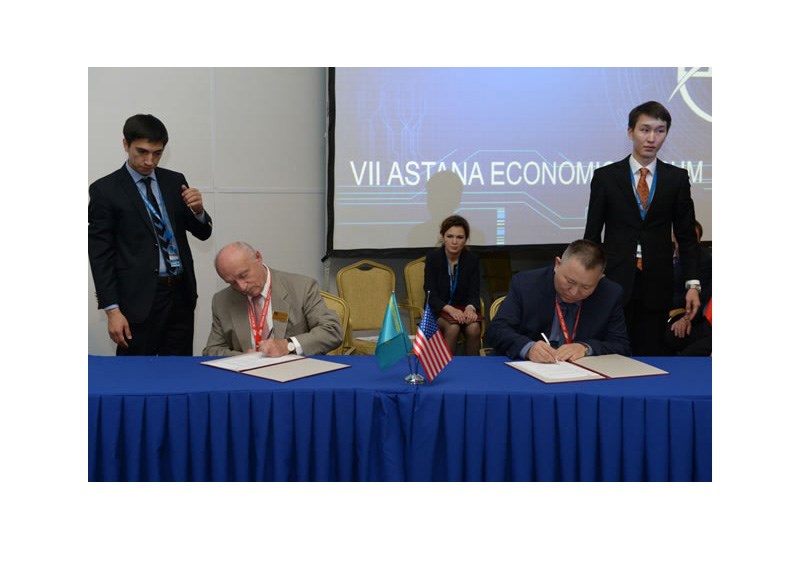 Moment of signing the agreement  between AETC UMass and IPT Academy of Science, Republic of Kazakhstan in 2014.