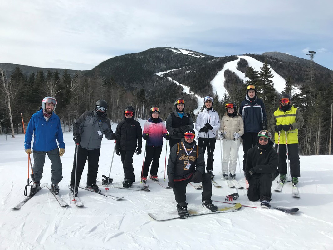 UMass Lowell's Ski and Snowboard Club poses together on the slopes