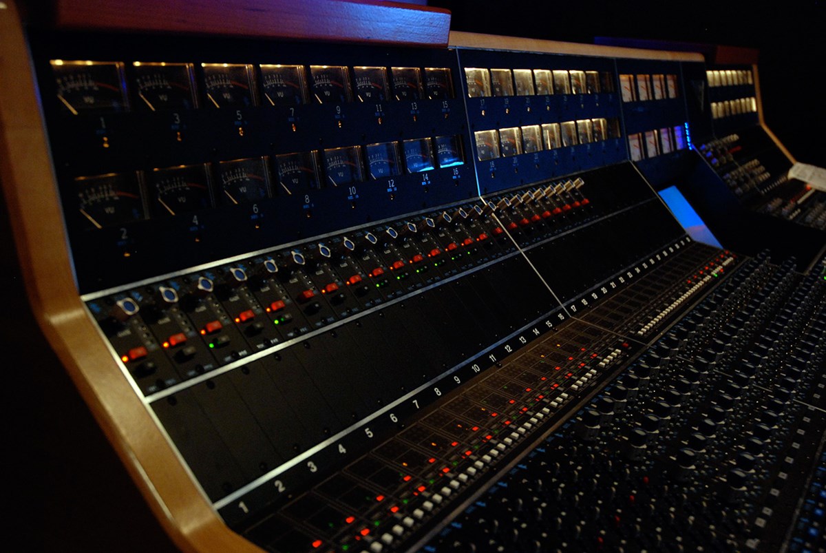 A side view of a soundboard in a studio of the Sound Recording Technology program.