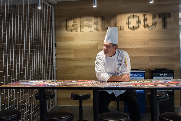 Executive chef Frank Hurley sits at a seating area at the South Campus Dining Commons