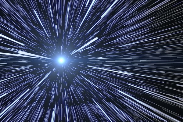 Conceptual image of stars streaking by during space warp