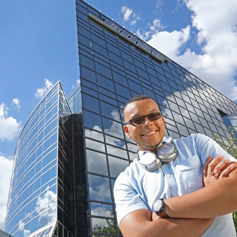 co-op student poses outside Bose headquarters