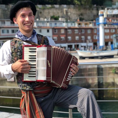 Nicholas Acquaviva dresses the part as a Basque Farmer with his accordion as part of a Honors study abroad trip tp San Sebastian, Spain.