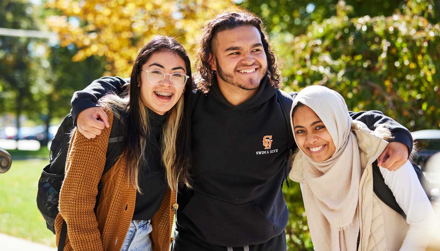 Three students pose together
