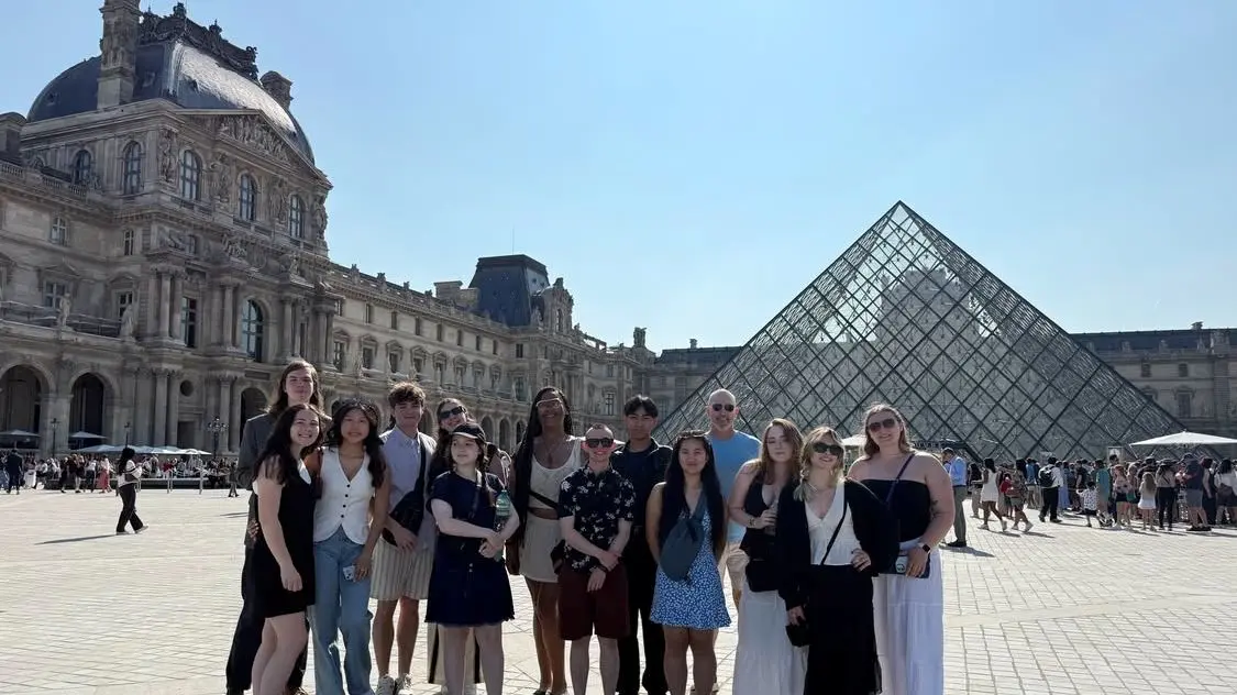 Students in plaza in front of museum