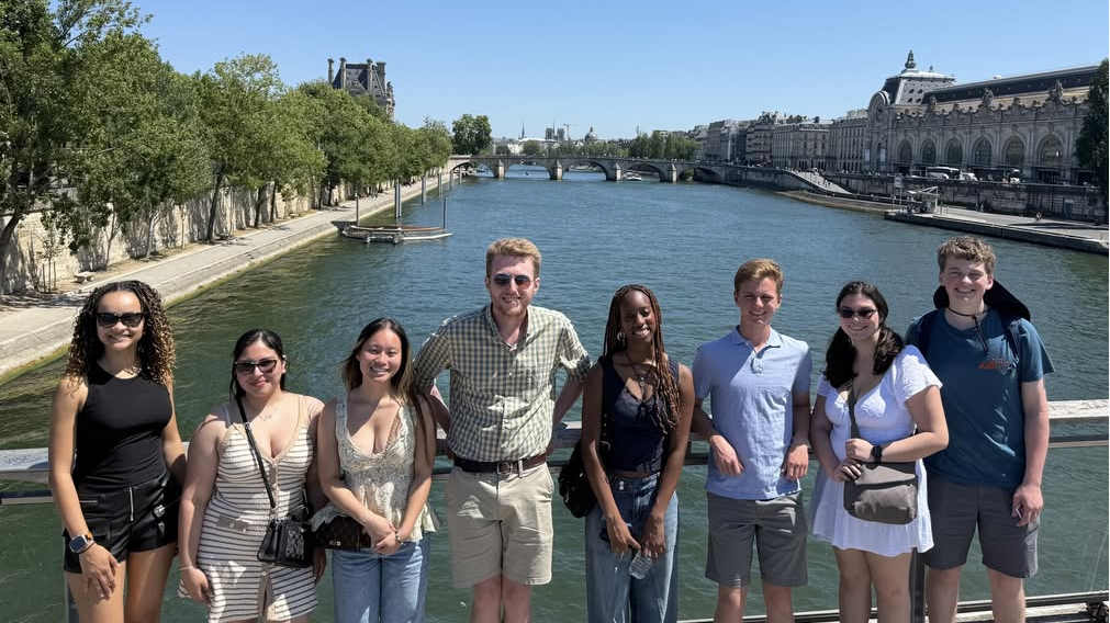Group of students standing on bridge