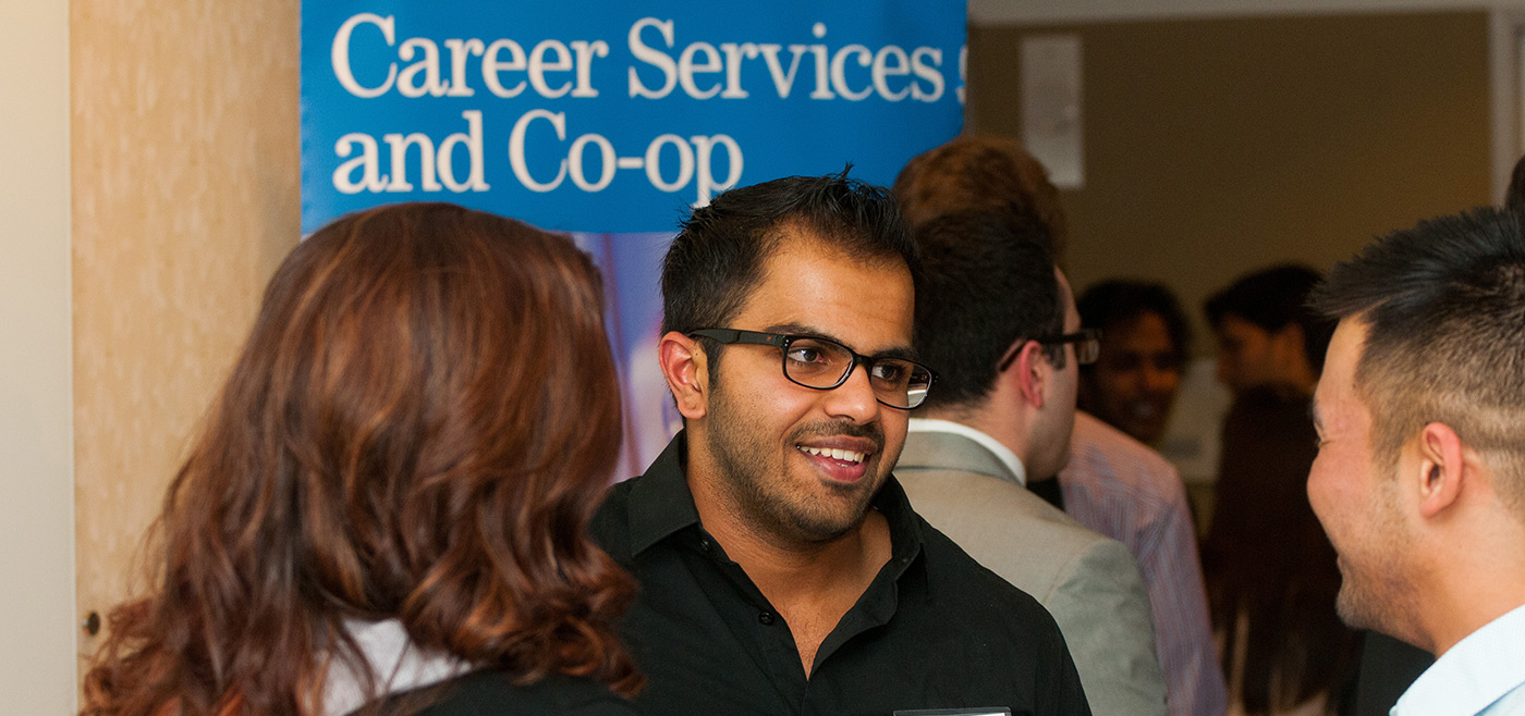 Attendees mingle before dinner at the Career & Co-op Center's Dine & Dress for Success event.