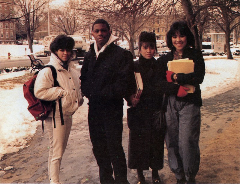 Students pose on a snowy sidewalk on North Campus in 1987