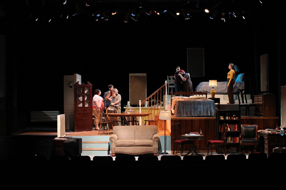 Students performing on stage during a UMass Lowell Theatre Arts production.