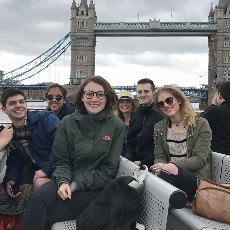 A group of UMass Lowell design students in front of Tower Bridge in London.