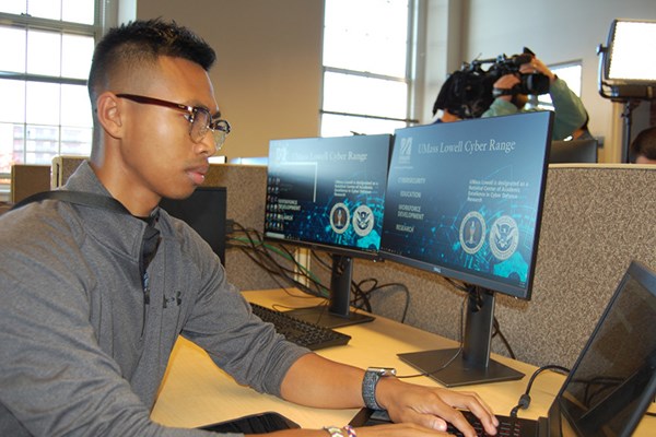 UMass Lowell student Zachary Perlmutter working at the newly-opened Cyber Range center