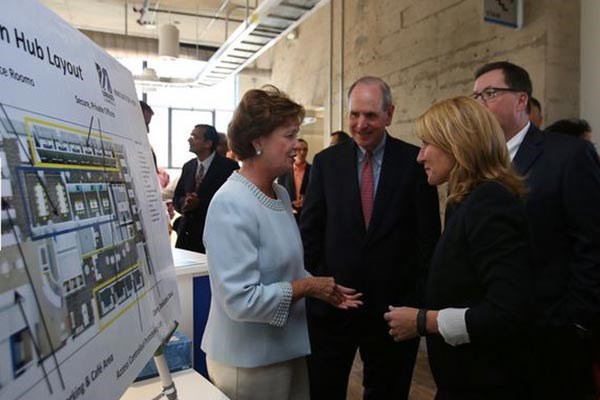 Lt. Gov. Karyn Polito, right, greets UML Chancellor Jacquie Moloney at the opening of UMass Lowell's Innovation Hub and expansion of M2D2 at 110 Canal St. Lowell Sun photo