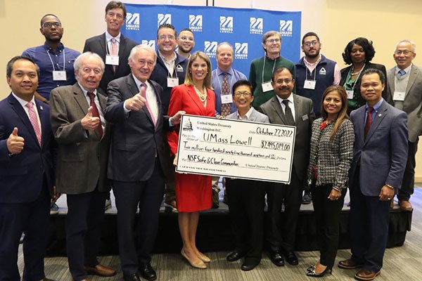 UMass Lowell team and partners hold giant NSF check