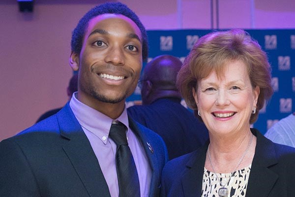 Chancellor Jacquie Moloney with Daniel Howell, president of the UMass Lowell student-run organization Men Achieving Leadership, Excellence and Success