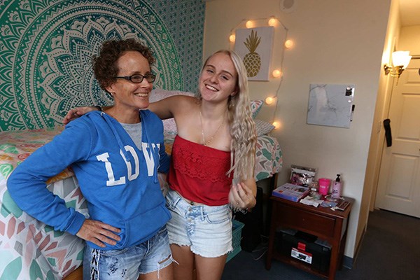 Brianna Langlois joins her mother Susan in her room at the UMass Lowell Inn and Conference Center