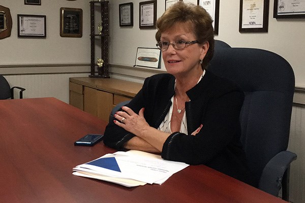 UMass Lowell Chancellor Jacquie Moloney speaks to reporter