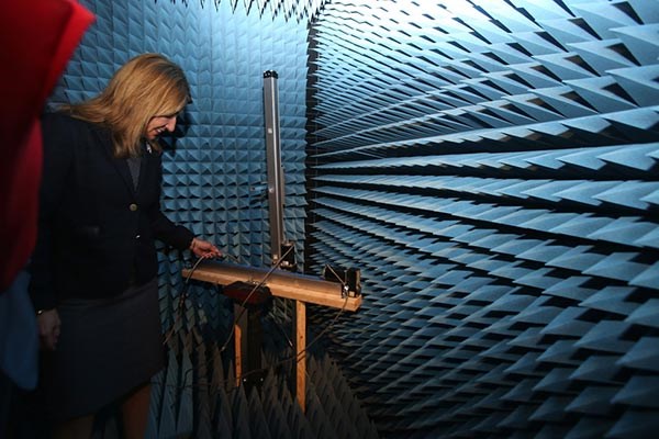Lt. Gov. Karyn Polito steps inside an anechoic chamber (echo-less chamber) during a visit to the Printed Electronics Research Collaborative at UMass Lowell on Tuesday. 
