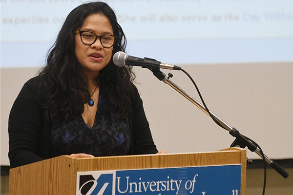 Noy Thrupkaew, an anti-human-trafficking activist and UMass Lowell's 2017 Greeley Scholar for Peace Studies, at podium