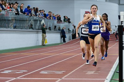 UMass Lowell track star Alli Wood running in race on indoor track