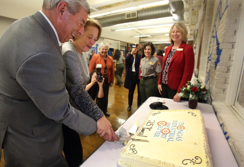Special Asst. to the Chancellor Don Pierson and Congresswoman Niki Tsongas cut cake at TIHC anniversary party