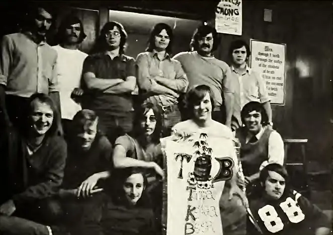 Black and white photo of young men in the 1970s in a dorm room