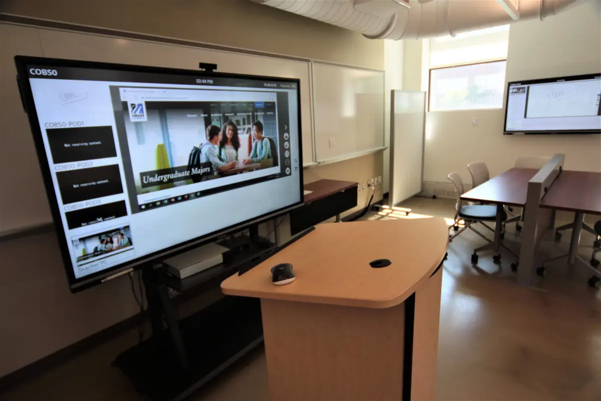 Classroom podium with large monitor and other smart technology