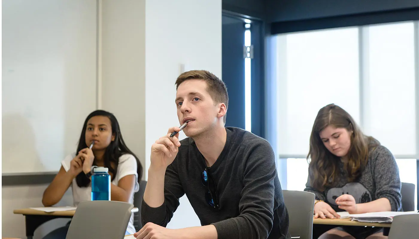 Thoughtful students in UMass Lowell classroom