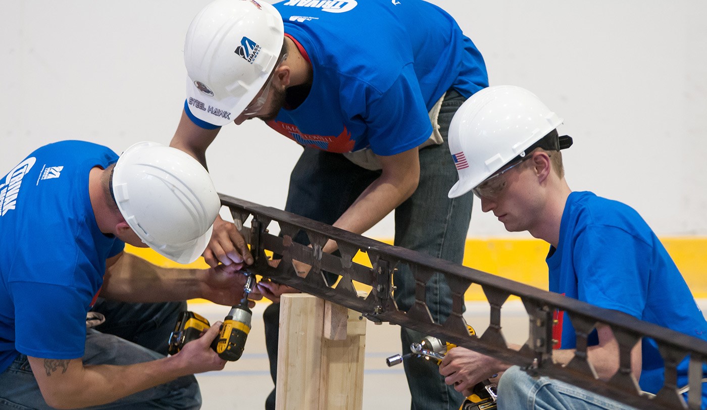 Three UMass Lowell students taking part in the Steel Bridge Competition.