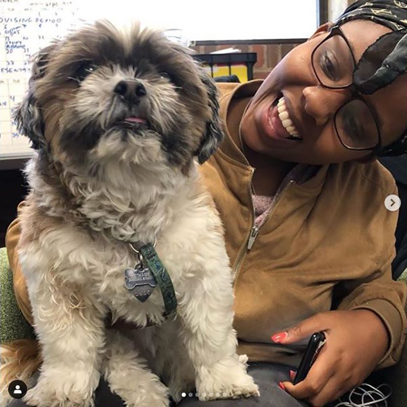 Tippy the dog with smiling student