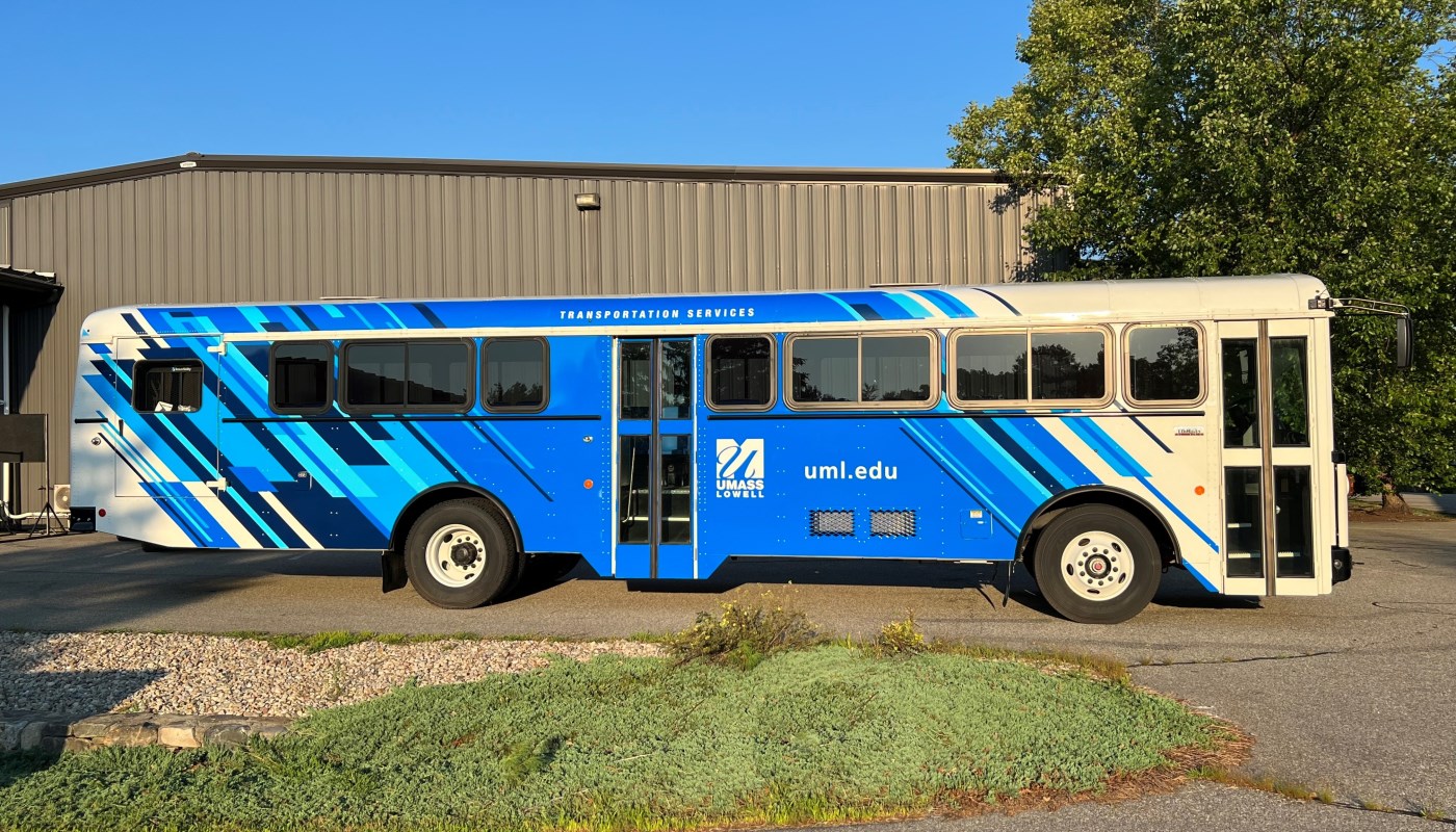 A blue UMass Lowell bus