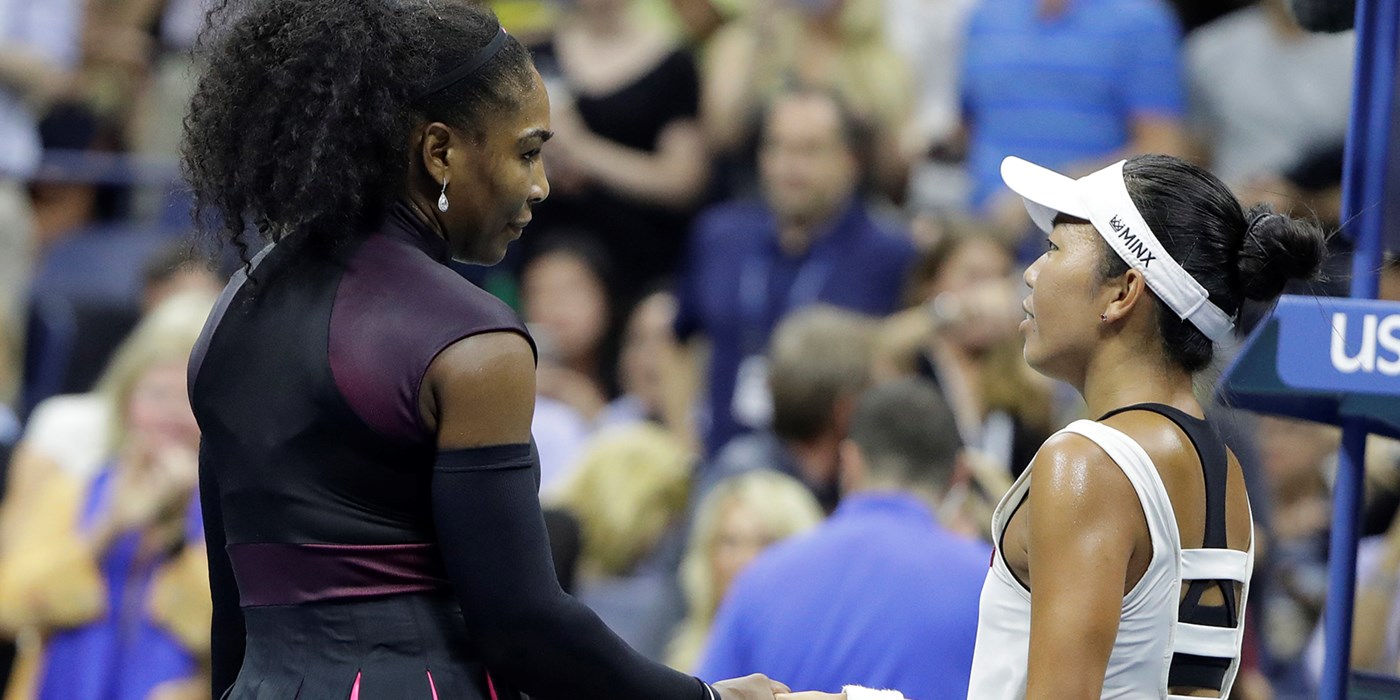 Vania King shakes hands with Serena Williams after a tennis match