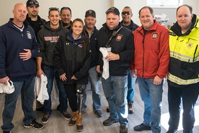 Noelle Lambert poses with her rescuers