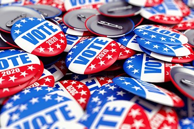 Pile of red, white and blue vote buttons