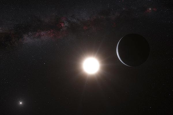 An artist's impression shows the planet orbiting the star Alpha Centauri B. Our own sun is in the upper right.