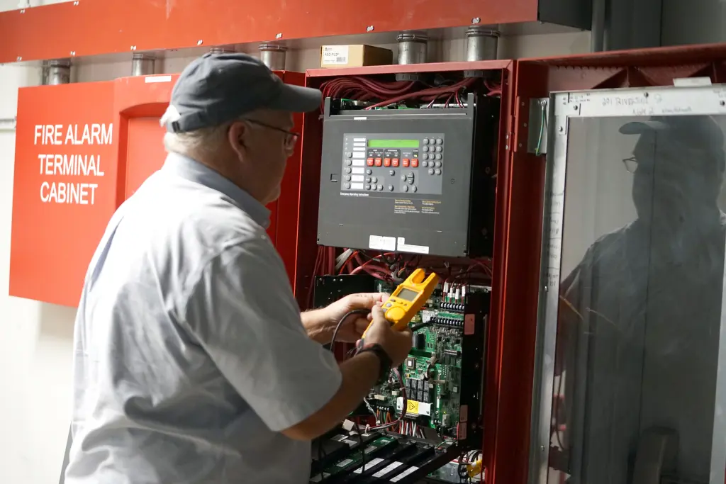 Worker at electrical panel