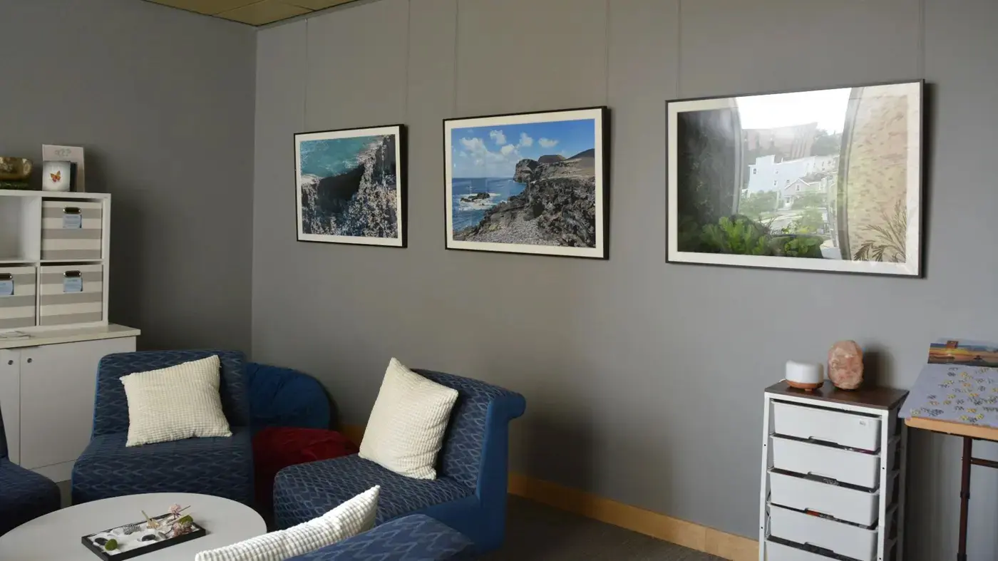 an inviting room with a table, comfortable chairs, and decorations