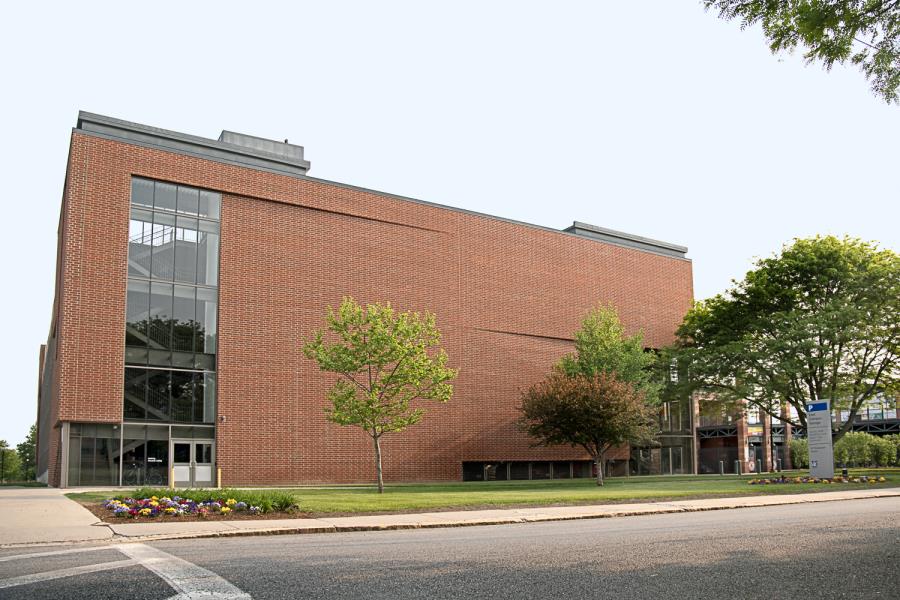 Garage: Side of four-story red brick parking garage, as seen from street